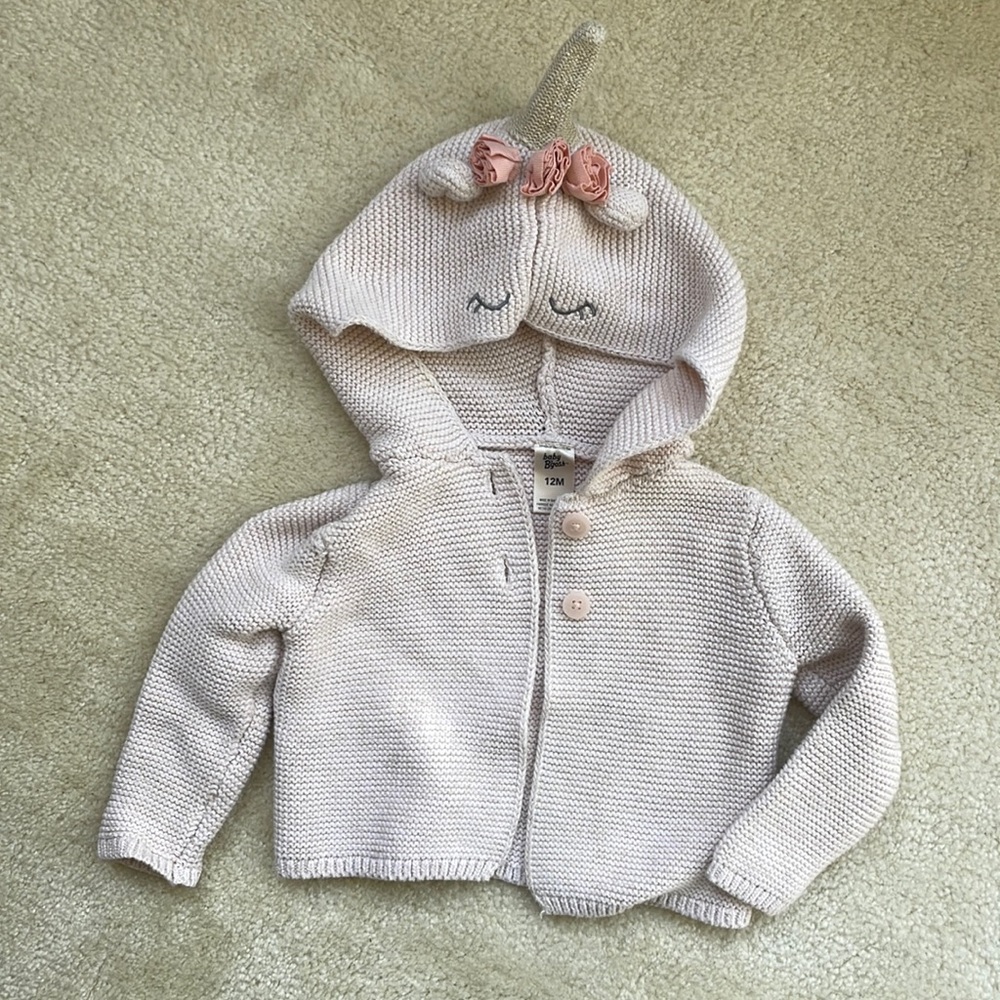 Pale pink knitted cardigan with unicorn hood